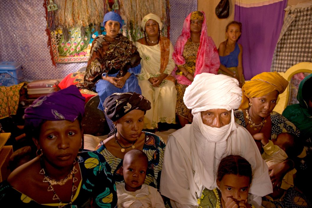 NIGER. Tajae. Slave trader and Tuareg chieftain Ibrahim Agali with his wives and family members inside the Tuareg palace. 2005.